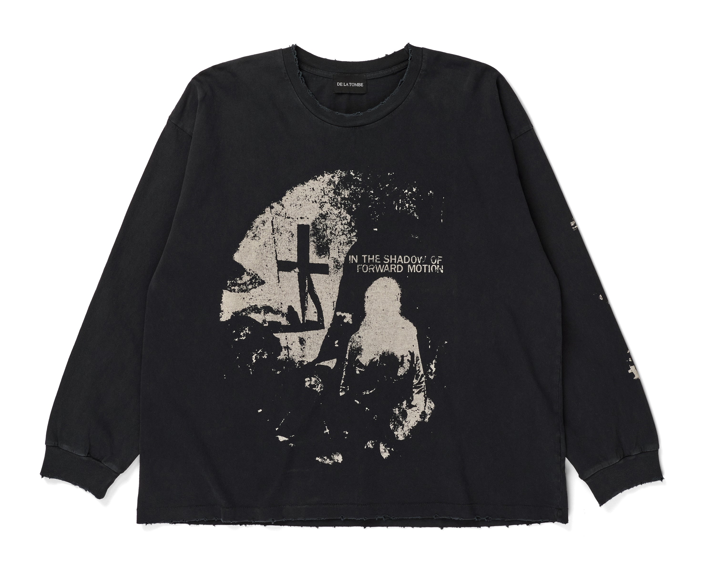 A black long-sleeve t-shirt with a distressed, vintage-style graphic print on the front. The graphic features a circular design with a cross, a silhouette of a person, and the text 'IN THE SHADOWS OF FORGED MUTHEN'.